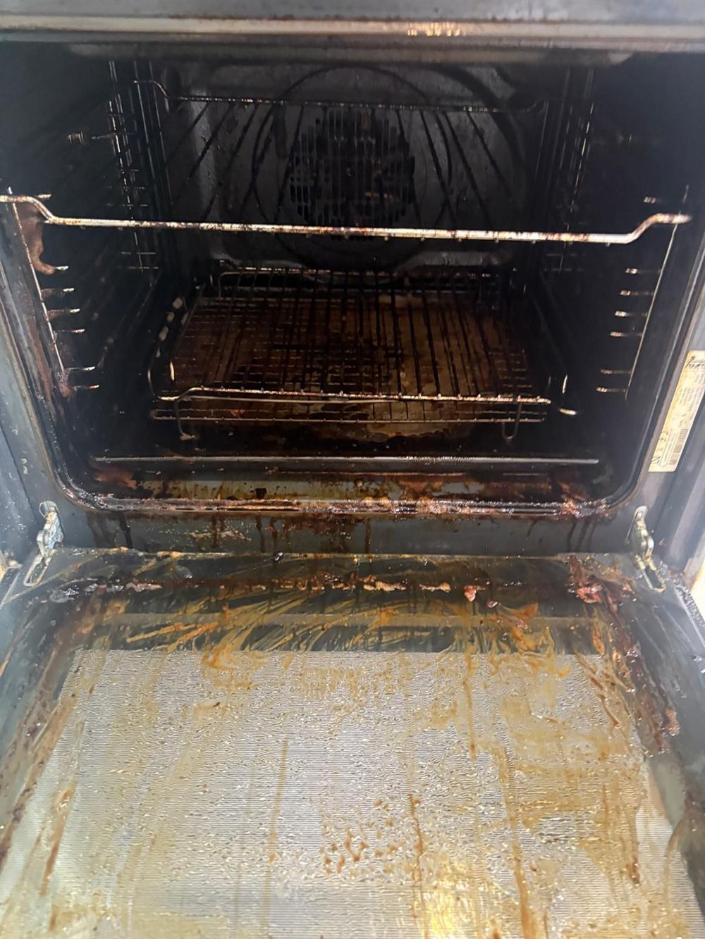 Before oven cleaning Dublin with racks and built up residue