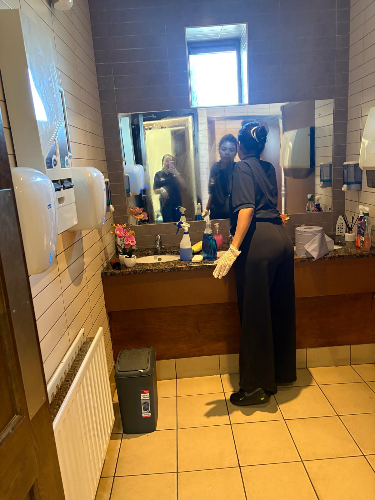 Professional cleaning team Dublin cleaning a commercial bathroom