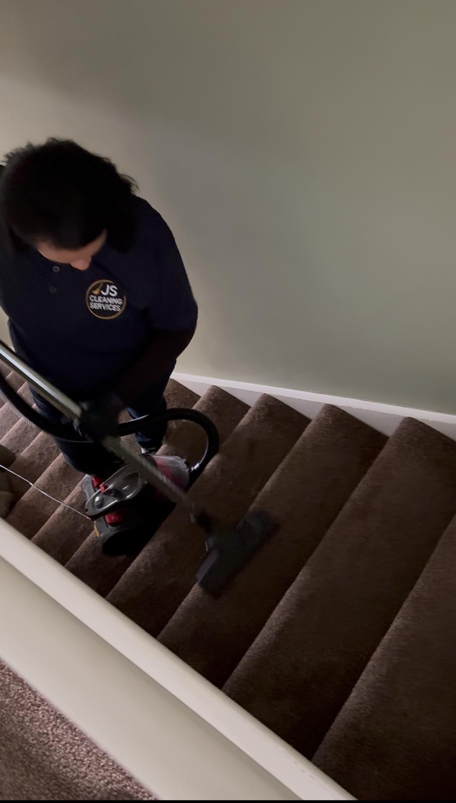 Professional cleaning team Dublin vacuuming residential stairs